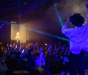 Musical guest singing at a concert