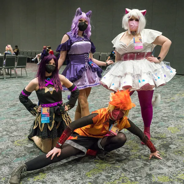 Cosplayers posing at the convention