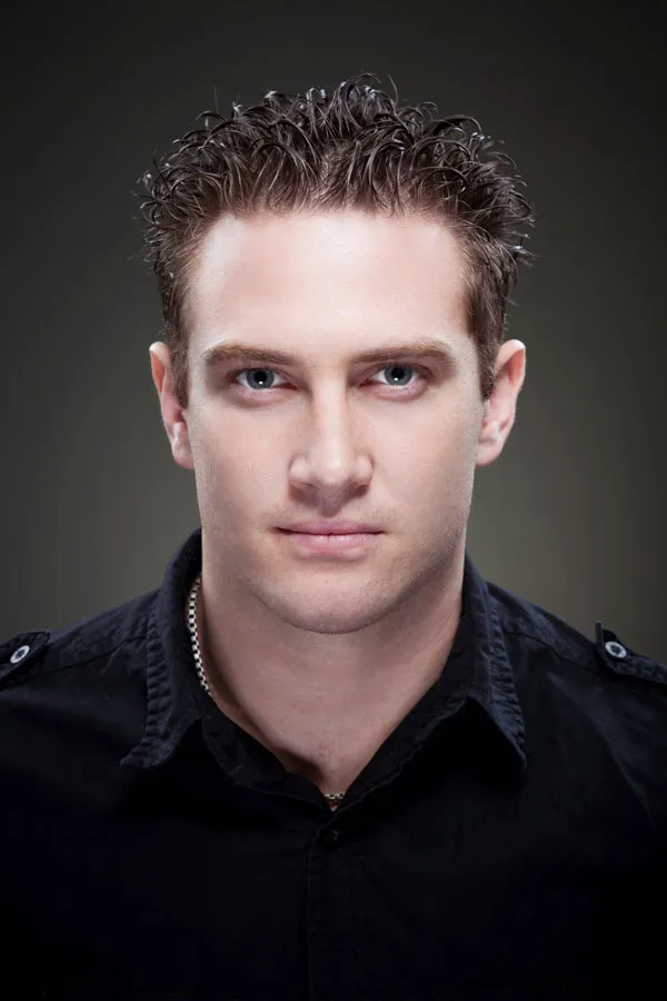 Portrait of Bryce Papenbrook in a black shirt.