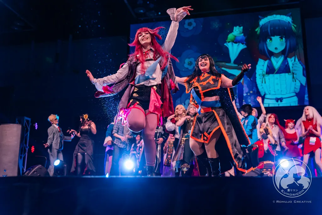 Performers dancing and celebrating on stage amidst falling confetti during the 2023 Lip Sync Showdown.