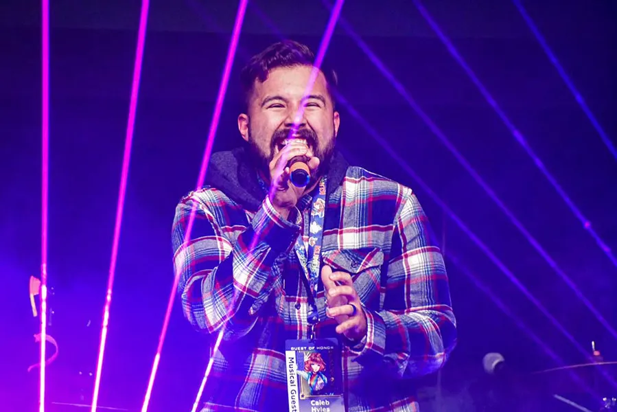 Caleb Hyles singing on stage