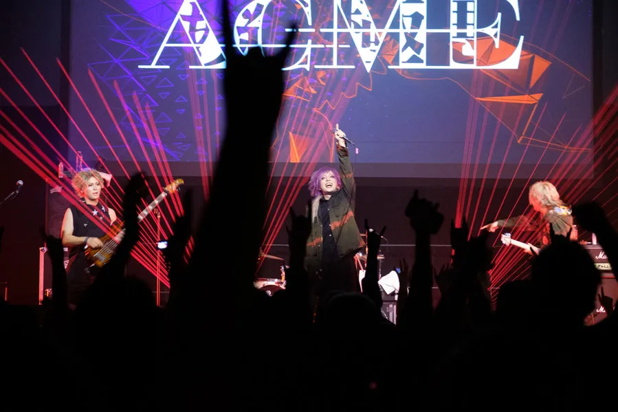 ACME performing live on stage